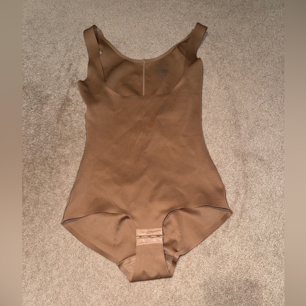 Shinny tan body suit